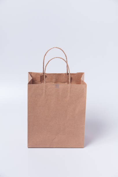 istock Brown shopping bag on gray background 1003830360