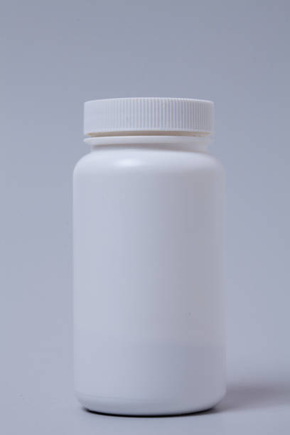 istock White medical container on gray background 1003830660