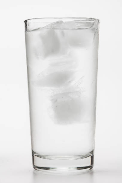 Ice water in the glass on white