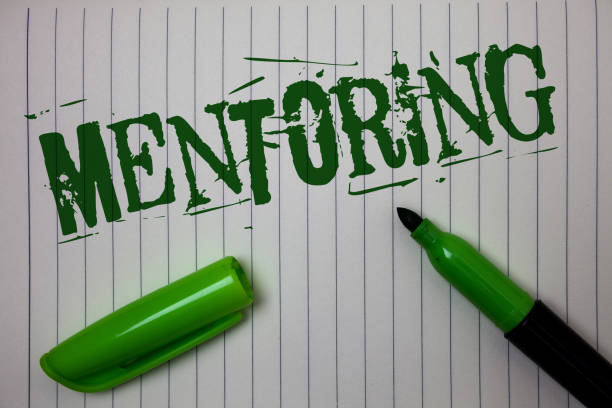 istock Handwriting text Mentoring. Concept meaning To give advice or support to a younger less experienced person Linned paper background pen cap marker highlighter ink green drawing. 1003870078