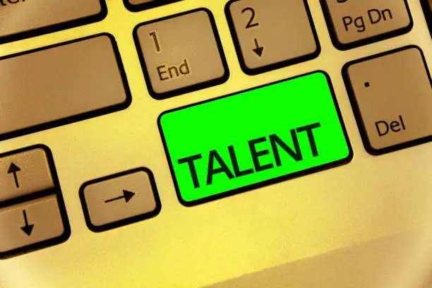 Photo of Text sign showing Talent. Conceptual photo Natural abilities of people showing specialized skills they possess Keyboard key laptop creative computer brown keypad idea notebook netbook.