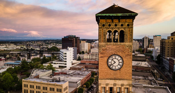 Aerial View City Clocktower in Downtown Tacoma Washington Mt Rainier can be seen in the background at sunset in Tacoma Washington USA tacoma photos stock pictures, royalty-free photos & images