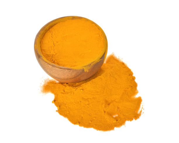 istock Top view of turmeric powder isolated on white background 1003881134