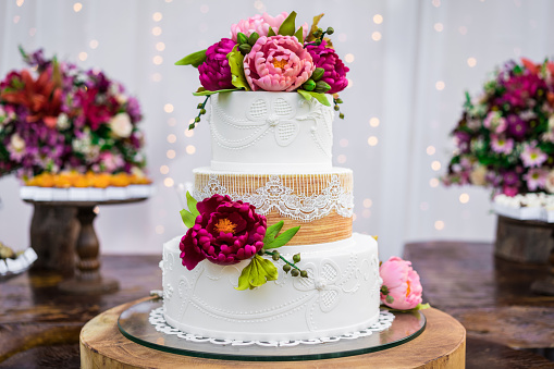 festive white and pink cake on a light background. Sweets concept