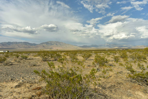 istock cloudy sky over Mojave desert valley and mountain ranges around Pahrump, Nevada, USA 1003904202