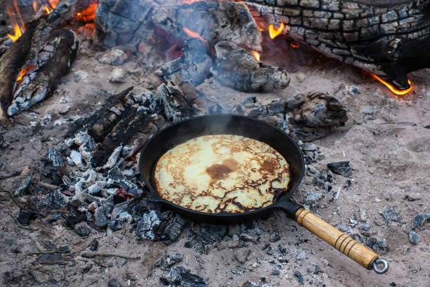 istock Cooking pancakes on the fire in the forest. 1003910150