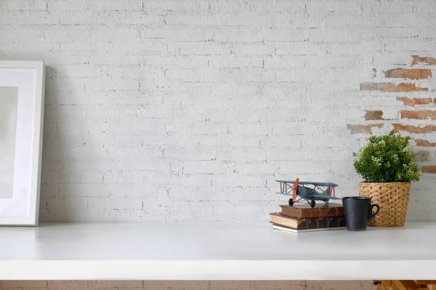 istock Stylish workspace with poster and gadget.