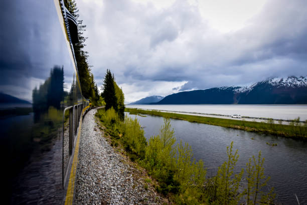 Train in motion POV from the window of a train in motion through the Chugach National Forest, Alaska chugach national forest photos stock pictures, royalty-free photos & images