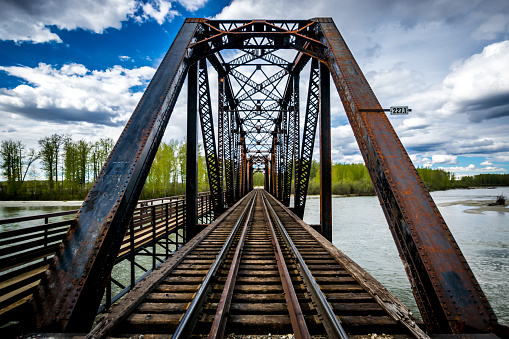 Old metal railway bridge over Talkeetna river, Alaska.