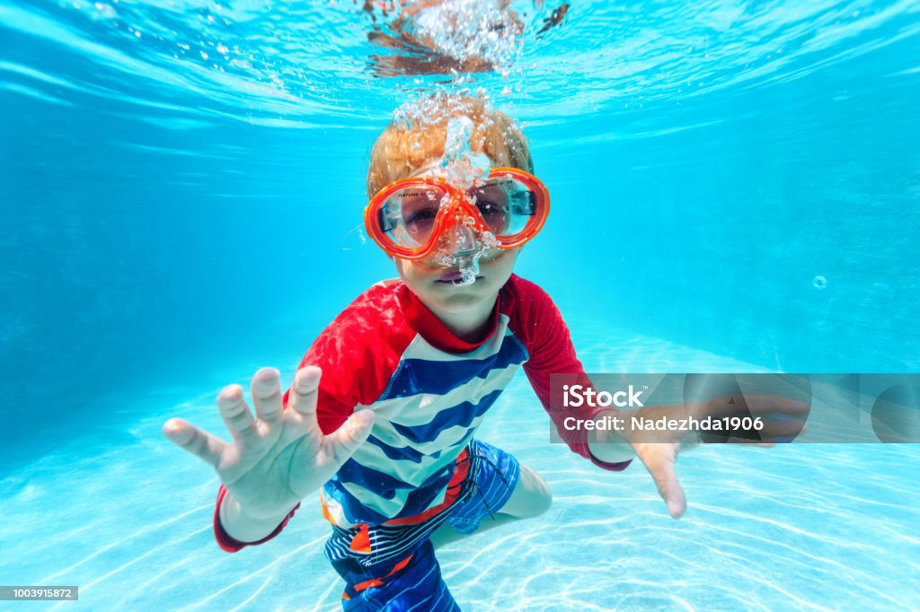 little boy swimming underwater little boy swimming underwater, active kids Child Stock Photo