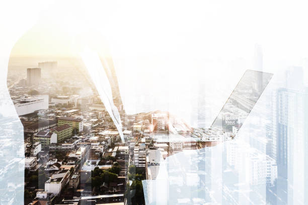 istock smart handsome asian business manworking with laptop double exposure with city scape night time 1003943270