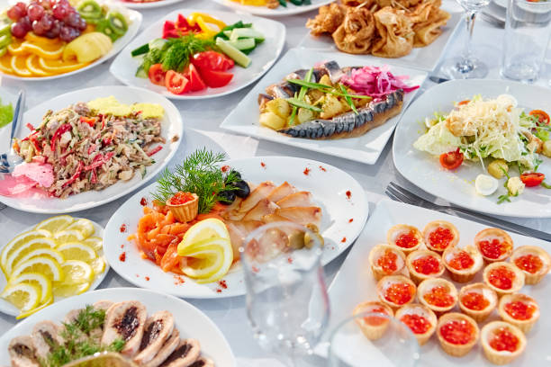 istock Beautifully decorated catering banquet table with different food 1003943702