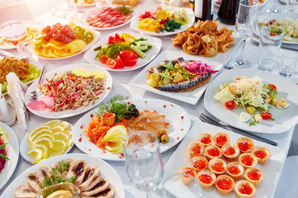 istock Beautifully decorated catering banquet table with different food 1003943716