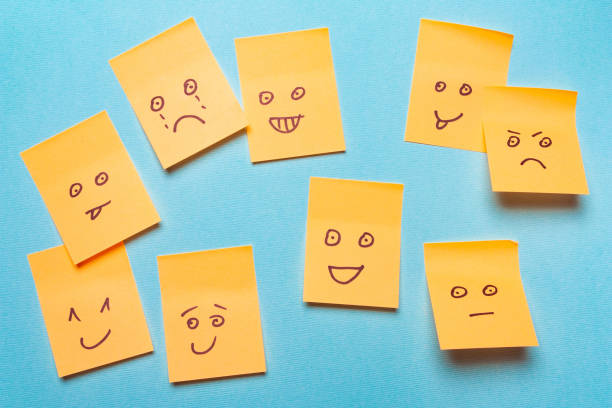 istock Funny stickers, notes with a smile on a blue background 1003957270