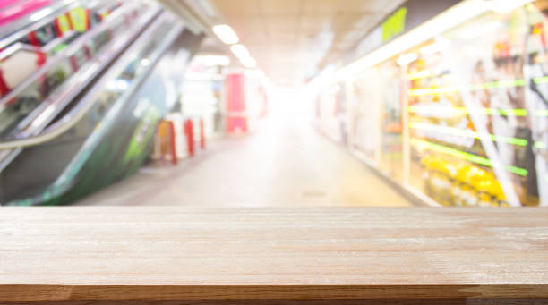 istock Empty wood table on department store blur background / Defocused blur background / can be used for display your product 1003961960