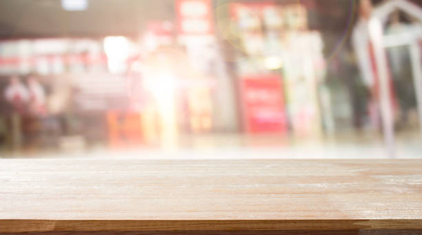 istock Empty wood table on department store blur background / Defocused blur background / can be used for display your product 1003962218