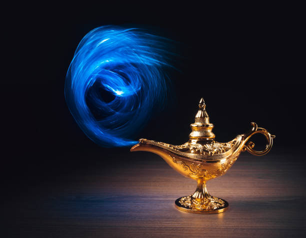 istock Magic Lamp with smoke in a dark background 1003976536