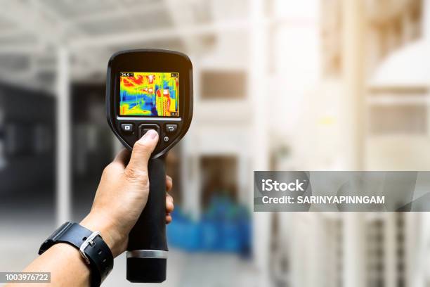 Technician Use Thermal Imaging Camera To Check Temperature In Factory Stock Photo - Download Image Now