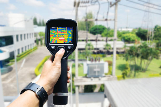 istock Technician use thermal imaging camera to check temperature in factory 1003976748