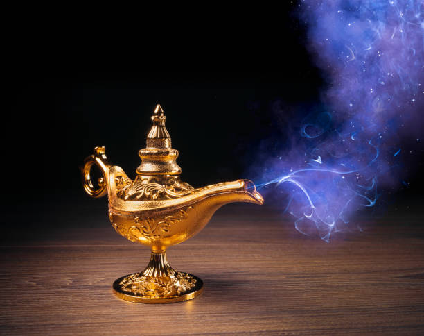 istock Magic Lamp with smoke in a dark background 1003977106