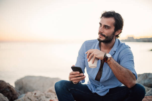 istock Charming man by the sea 1003982730