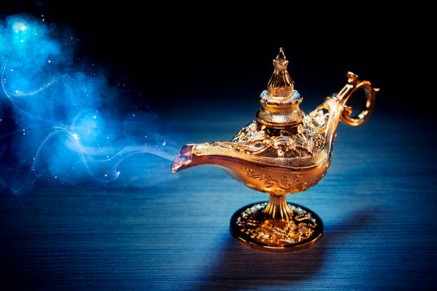 istock Magic Lamp with smoke in a dark background 1003983096