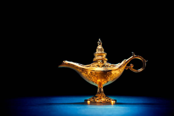 istock Magic Lamp with smoke in a dark background 1003983136