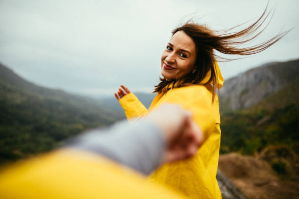 istock Woman in raincoat smile 1003989662