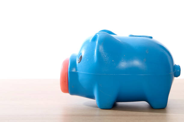 istock Piggy bank on over white background 1003990262