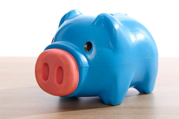 istock Piggy bank on over white background 1003990340