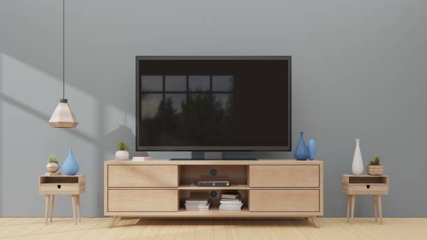 istock Mock up TV room in room interior dark wall background 1003991040