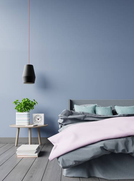 istock Bedroom interior with bed lamp and green plants 1003991068