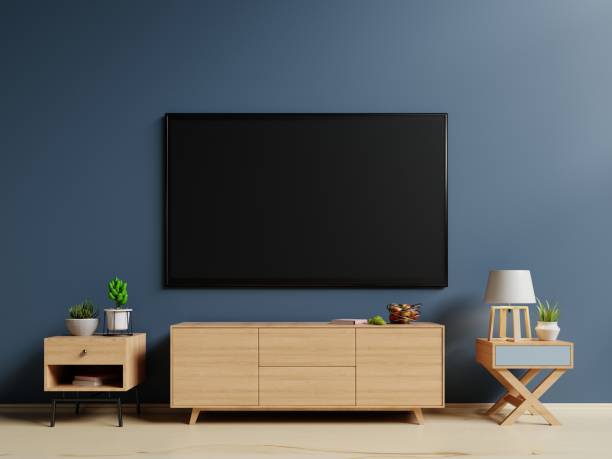istock Smart TV on the blue wall in living room 1003991088