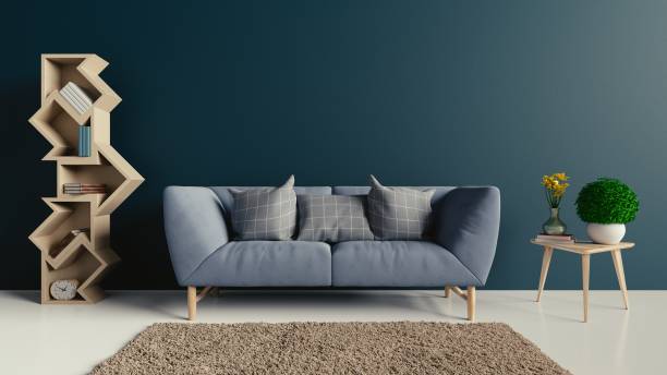 istock Bookshelf and sofa the wall with books and clock 1003991114