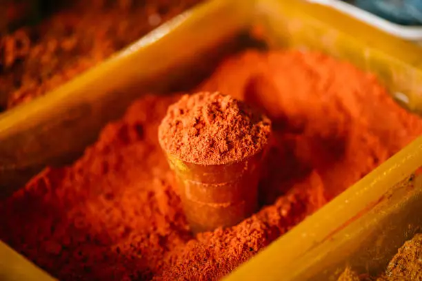 Photo of Close View Of Powdered Paprika Spice Bright Red Fragrant Seasoning Condiment In Glass At Bazar