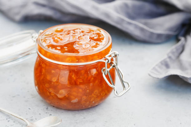 istock Glass jar with cloudberry jam. Nordic cuisine. 1003993306