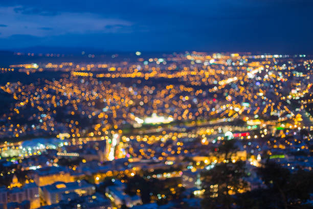 istock Blurred Bokeh Architectural Urban Backdrop. Background With Urban Defocused Lights 1003993996