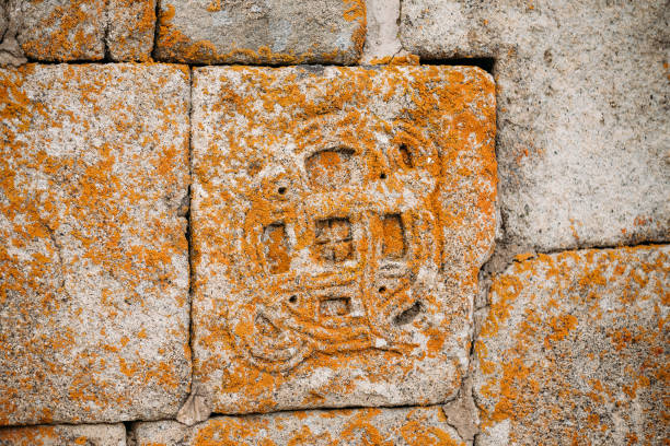 istock Architectural Details Of Bas-reliefs On Wall Of Gergeti Trinity Church. Tsminda Sameba - Holy Trinity Church Near Village Of Gergeti Near Kazbegi In Georgia 1003994062