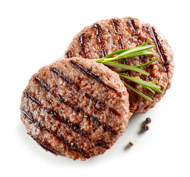 freshly grilled burger meat freshly grilled burger meat isolated on white background, top view burgers stock pictures, royalty-free photos & images