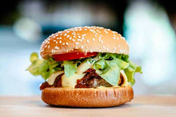 istock Beautiful Beef Cheese burger with spring lettuce and fresh tomato 1003994866