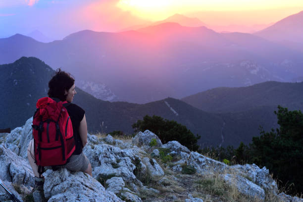 istock hiker contemplating the sunset 1004001642