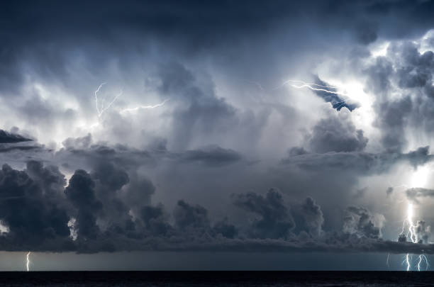 istock Lightning in the sea with high clouds 1004004450