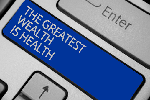 Conceptual hand writing showing The Greatest Wealth Is Health. Business photo text being in good health is the prize Take care Keyboard blue key create computer computing reflection document