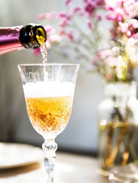 istock Pouring champagne into a glass 1004016006