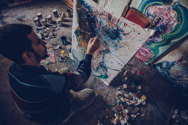istock Artist painting on the floor 1004016852