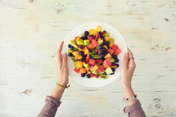 istock Mixed summer fruits salad top view 1004016884