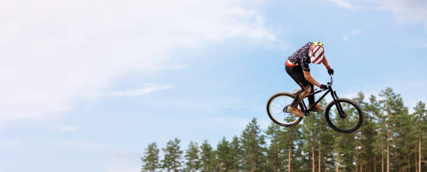istock rider is jumping high on a bicycle. copy space 1004019256