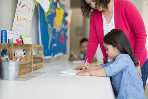 istock Mom homeschooling her young son 1004021924