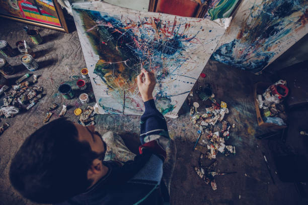 istock Man painting on the floor 1004023352