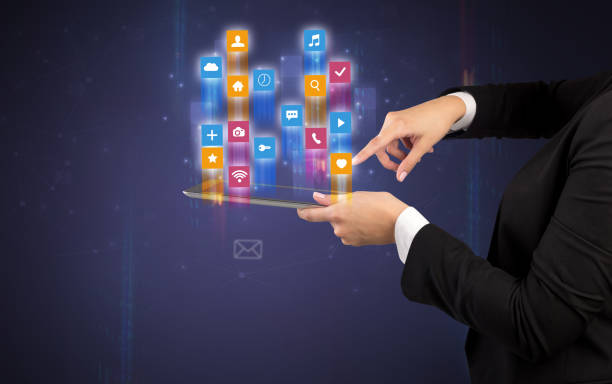 istock Classic application icons coming out from tablet 1004033804